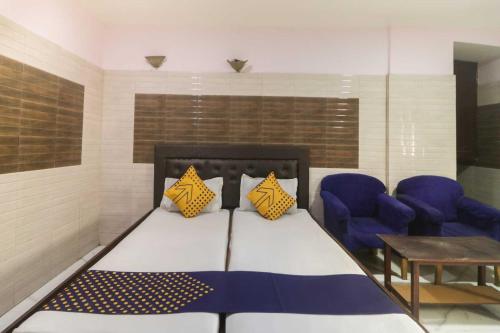Ένα ή περισσότερα κρεβάτια σε δωμάτιο στο Hotel O Maitry