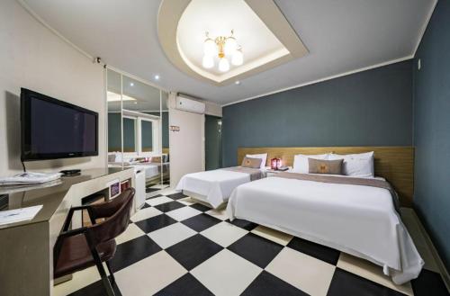 Katil atau katil-katil dalam bilik di S Hotel Sangmu