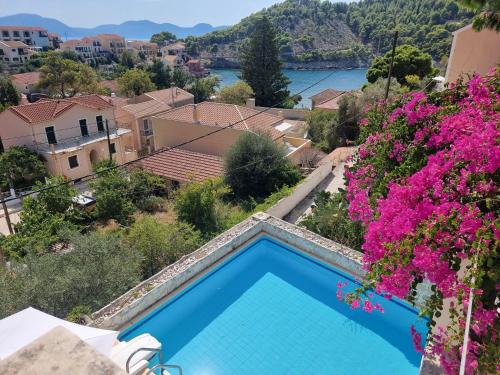 a villa with a swimming pool and a view at Blue Note House in Asos