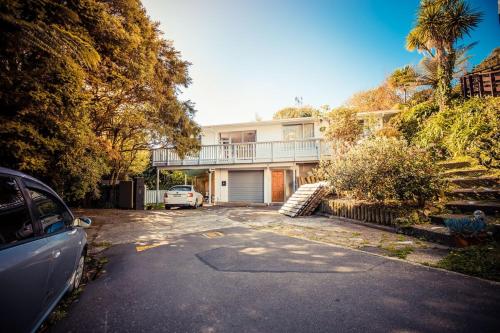 a car parked in front of a house at big sale was 258 now from 138 for 2or3 bedrooms in Wellington