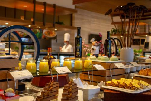 a buffet line with food on display in a restaurant at Shangrao International Hotel in Shangrao