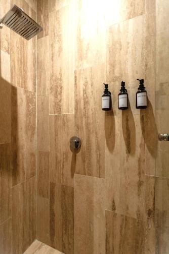 a shower with three candles on the wall at DM504 Apartment with Spectacular Views in Puerto Morelos