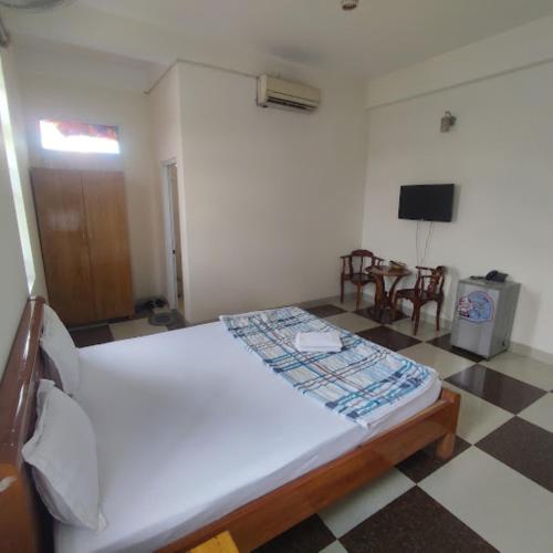 Katil atau katil-katil dalam bilik di Hoàng Nam Hotel Thủ Đức