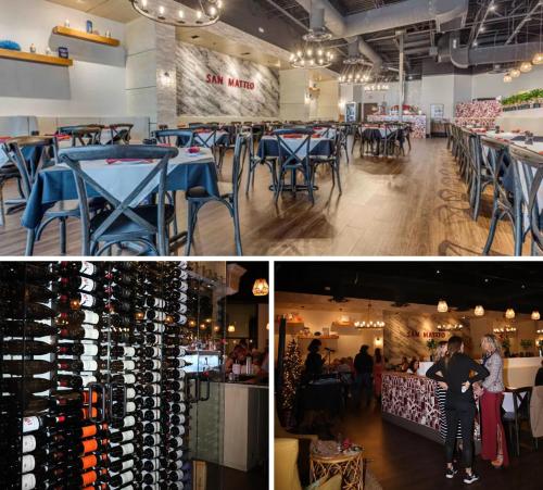 una stanza con un mucchio di tavoli e un mucchio di bottiglie di vino di Casa compartida vacacional a La Belle