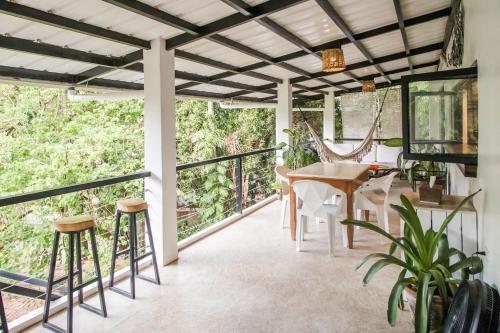 Un balcón o terraza de SANGLEY Nest Eco Home with Self-Service Breakfast - Big Garden, Monkeys, Pet Friendly with a Fee