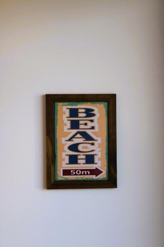 a picture of a soda sign on a wall at Apto de duas suítes com vista mar - 100 metros da praia em Canasvieiras in Florianópolis