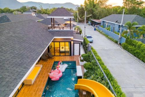an aerial view of a house with a swimming pool at Hua Hin Pool Villa and Pool table with 3 bedrooms, 3 bathrooms near Cha-Am beach in Nikhom Sang Ton Eng Khuan Phet