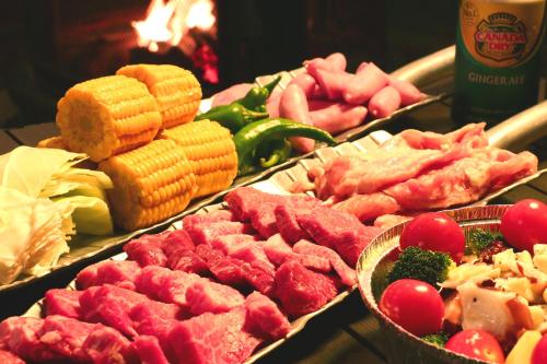 a buffet of different types of meats and vegetables at まほろばの家 in Awaji