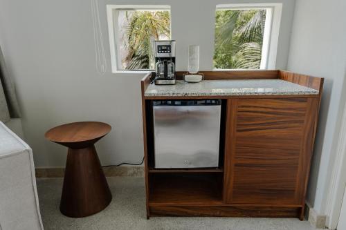 a counter with a coffee maker on it in a room at Condos Privados en Huatulco in Tangolunda