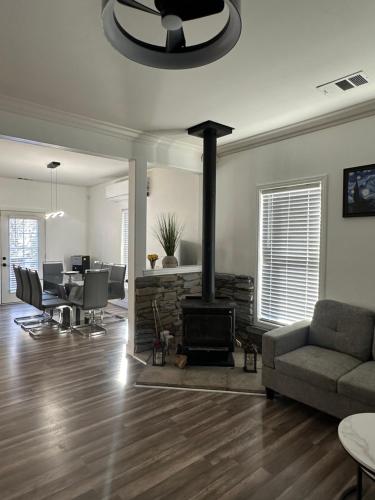a living room with a couch and a fireplace at Enjoy Privacy - Pine Mountain - Spacious Home in Pine Mountain Club