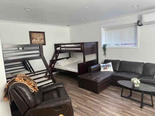 a living room with a couch and a bunk bed at Enjoy Privacy - Pine Mountain - Spacious Home in Pine Mountain Club