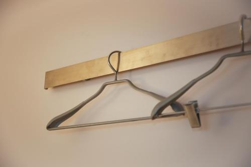 a wooden shelf hanging on a wall at First Cabin International Hawaii in Honolulu
