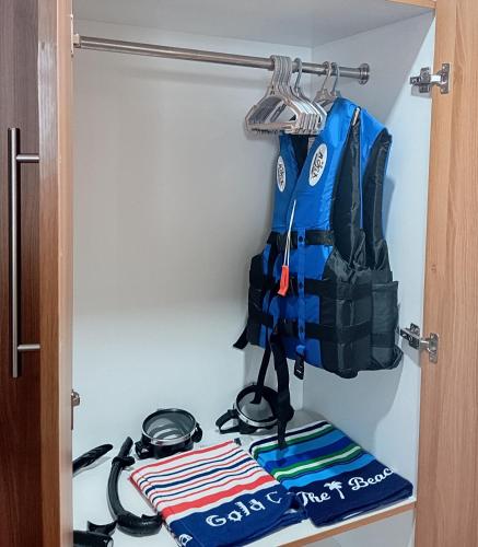 a closet with a rack with a fire hydrant at Riverduplex - Luxury duplex at a fair price in Dauis