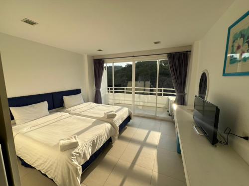 Postel nebo postele na pokoji v ubytování Santorini Huahin-Khaotao