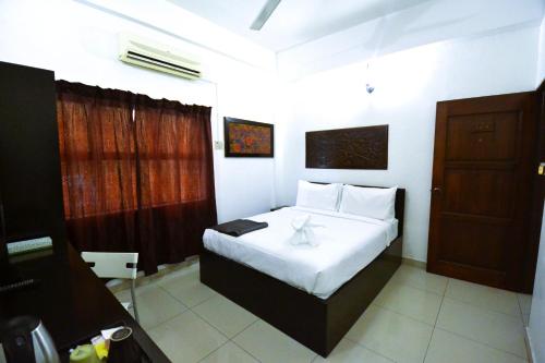 Una cama o camas en una habitación de AZYA Hotel