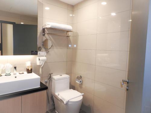 a bathroom with a toilet and a sink at Sky Retreat Genting Highlands in Genting Highlands
