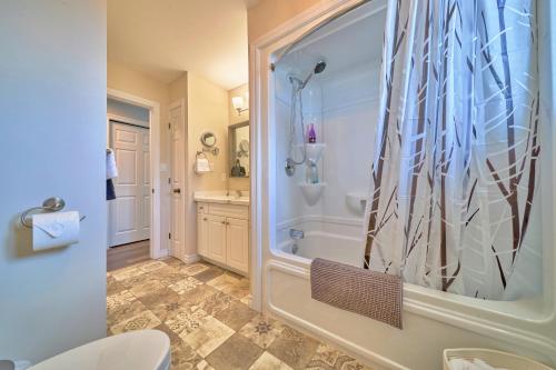 a bathroom with a shower and a toilet at Cozy Cottage for Fall Getaways, Private backyard, decks in Meaford