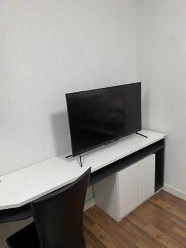 a white desk with a television on top of it at Mari's space city view in Nonthaburi