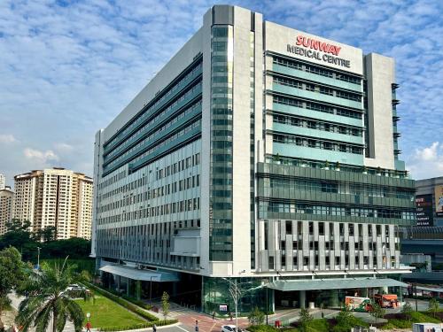 a building with a sign on the side of it at CozyHome 1-10pax Sunway Nexis link IOI mall & MRT in Petaling Jaya
