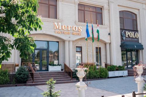 a mexico building with flags in front of it at Meros Boutique Hotel in Samarkand