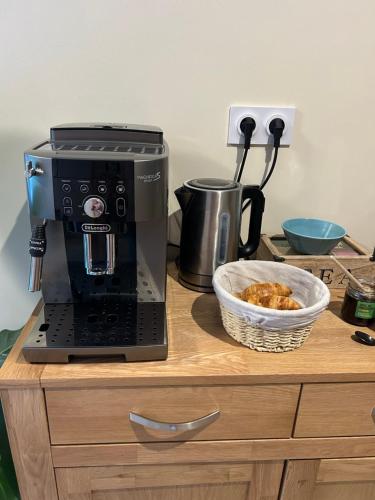 a coffee maker on a counter with a bowl of food at Domaine de Lithos in Fossemagne