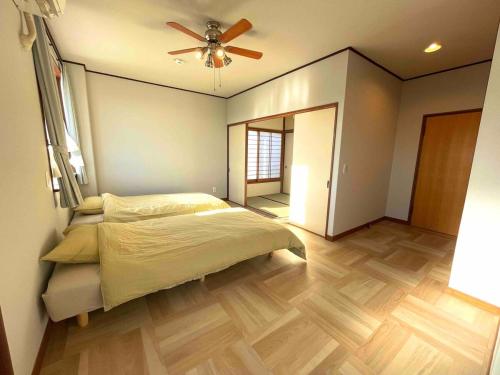 Cama o camas de una habitación en 勝浦一望貸切宿 Tona