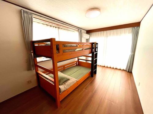 Cama o camas de una habitación en 勝浦一望貸切宿 Tona