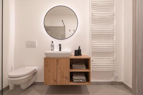 a bathroom with a sink and a mirror at Nika & Erik in Kranjska Gora