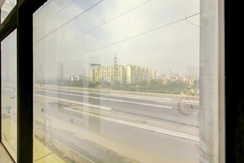 a view of a city from a window at Hotel Urban Lion - IGI Airport Delhi in New Delhi