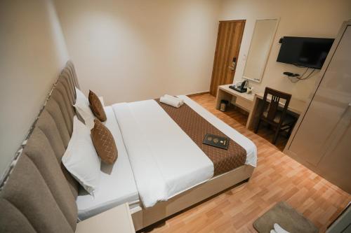 Televisyen dan/atau pusat hiburan di The Ambience Hotel Chandigarh Zirakpur