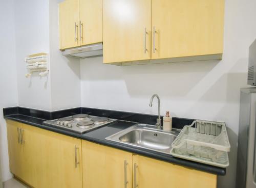 Η κουζίνα ή μικρή κουζίνα στο Cozy Place for 8 persons at Grass Residences