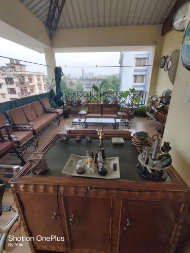a view of a living room with a table at Joyable Homestay Near Sankardev Netralay in Guwahati