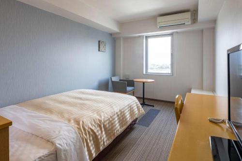 Postel nebo postele na pokoji v ubytování Comfort Inn Yokaichi