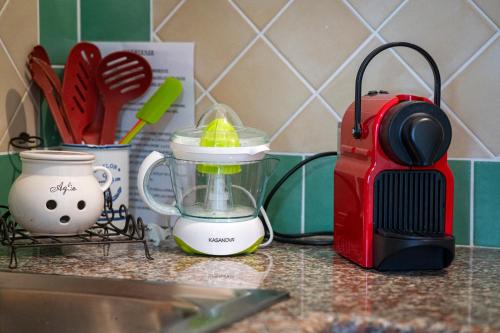 a blender sitting on a counter next to a sink at Casa Vacanze - Domus De Mar in Stintino