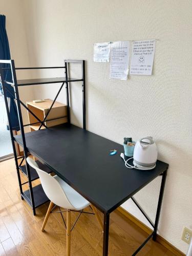 Postel nebo postele na pokoji v ubytování Osaka English House