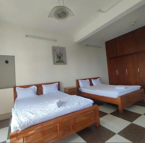 Katil atau katil-katil dalam bilik di Hoàng Nam Hotel Thủ Đức