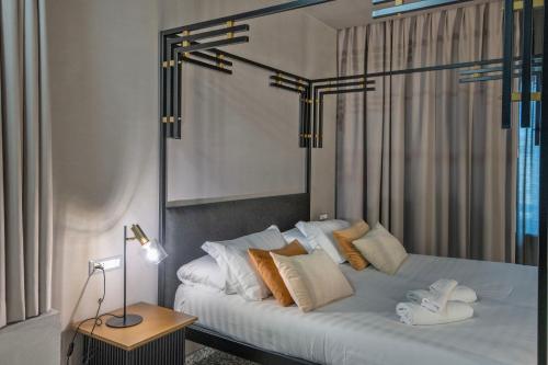 Una cama o camas en una habitación de Hotel Nuvò