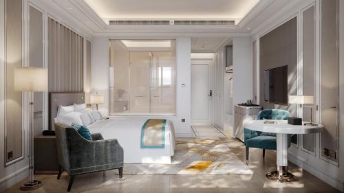a bedroom with a bed and a table and chairs at Hotel Anda China Malabo in Malabo