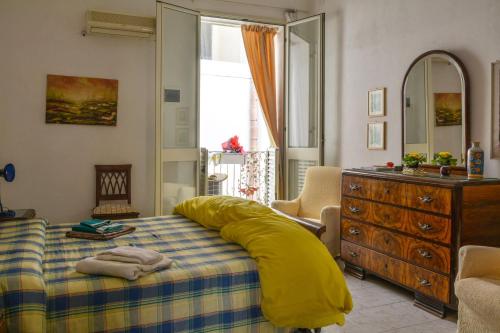 Postel nebo postele na pokoji v ubytování Casa Elena Al Duomo