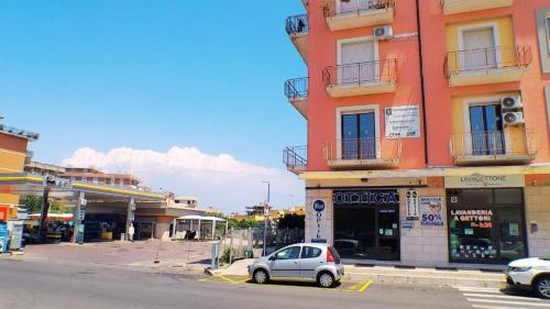 a small car parked in front of a building at Soverato Sweet Home 13 in Soverato Marina