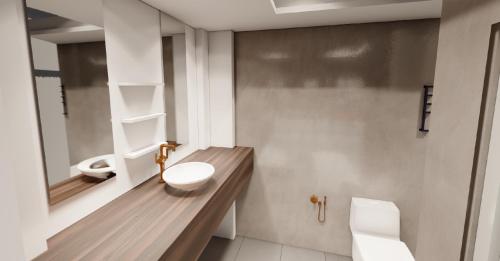 un bagno con un lavandino e un water di Nine House a Città di Malé
