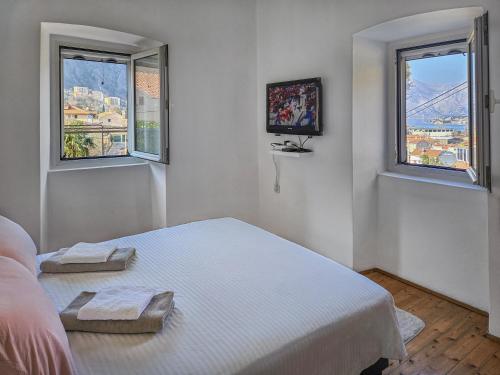 Katil atau katil-katil dalam bilik di Holiday House Kotor