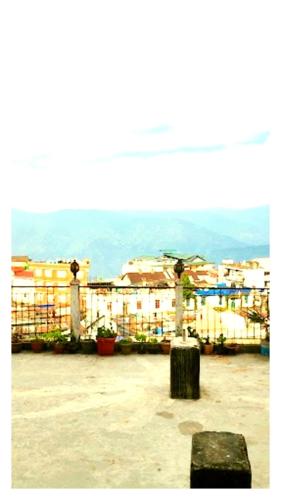 a view of a city with buildings in the background at Hotal North 4 Star darjeeling in Darjeeling