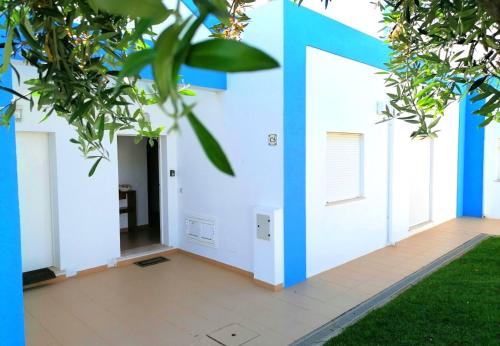 a room with blue and white walls and grass at Casa Tedi, Alto do Perogil, Tavira - 3 Bedroom, 3 Bathroom villa, large Pool, exquisite Gardens & Air-conditioning in Tavira