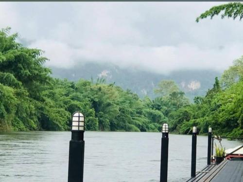 a view of a river from a dock at มาตาบุรี ริเวอร์เเควรีสอร์ท in Ban Gaeng Cho