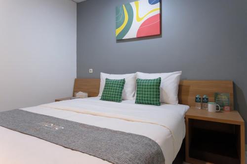 Ein Bett oder Betten in einem Zimmer der Unterkunft Mono Coliving Brotojoyo, Semarang