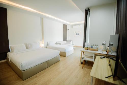 Postel nebo postele na pokoji v ubytování Phorpun Resort Lampang