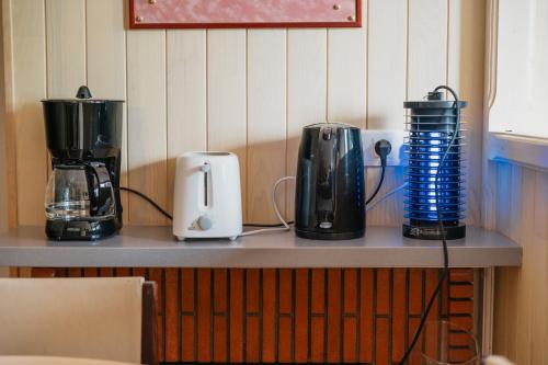 a counter with three appliances on top of it at La maison de la Rebergère in Javené