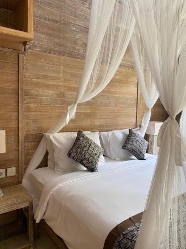 Ένα ή περισσότερα κρεβάτια σε δωμάτιο στο Tuwi Villa Ubud