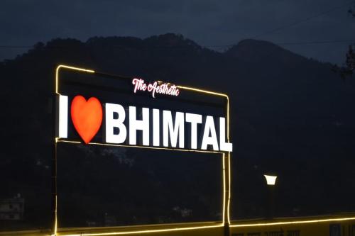 a sign for a billboard with a heart on it at The Aesthetic Hotel & Restaurant in Bhīm Tāl